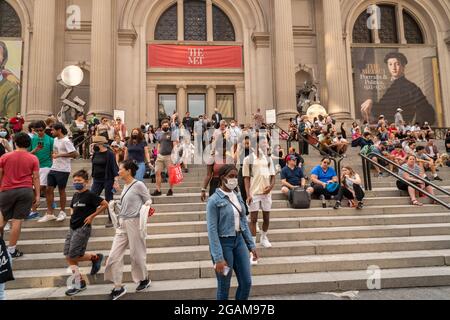 The Metropolitan Museum of Art in New York disgorges hundreds of visitors at closing time on Sunday, July 25, 2021.  (© Richard B. Levine) Stock Photo