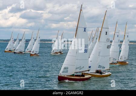 yachts racing off of cowes at the annual cowes week regatta on the isle of wight, uk Stock Photo