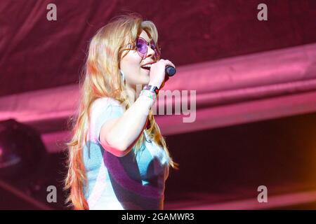 Lulworth, UK. 30th July, 2021. Becky Hill, aka Rebecca Claire Hill, British singer, songwriter and Voice UK Number One artist from Worcestershire performs live on stage during the Camp Bestival in Lulworth. Credit: SOPA Images Limited/Alamy Live News Stock Photo
