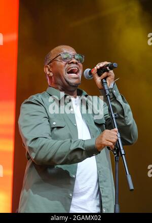 Lulworth, UK. 30th July, 2021. Grammy nominated British Jamaican soul singer Dennis Seaton, lead singer with British pop band Musical Youth performs live on stage during the Camp Bestival festival in Lulworth. Credit: SOPA Images Limited/Alamy Live News Stock Photo