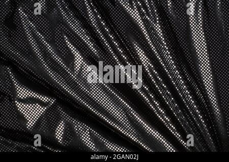 Gray black metalic silver polka dot fabric texture background Stock Photo