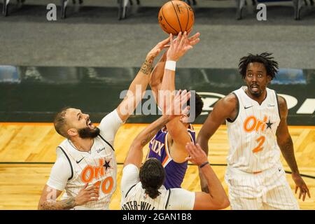 Orlando, Florida, USA, March 23, 2021, Phoenix Suns player is blocked the Orlando Magic's Evan Fournier #10 at the Amway Center  (Photo Credit:  Marty Jean-Louis) Stock Photo