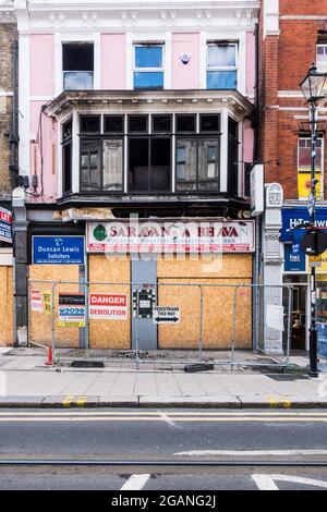 Fire accident destroyed Croydon Indian restaurant Saravan Bhavan and Solicitor office in the first floor of the building Stock Photo