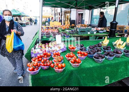 Croydon surrey street market vendors selling fruits and vegetables in open air market Stock Photo