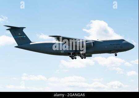 The mighty Lockheed C-5 Galaxy of the USAF is ready to land at Ramstein Air Base in Germany. Stock Photo