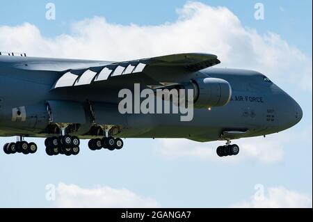 The mighty Lockheed C-5 Galaxy of the USAF is ready to land at Ramstein Air Base in Germany. Stock Photo