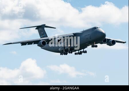 The mighty Lockheed C-5 Galaxy of the USAF is ready to land at Ramstein Air Base in Germany. Stock Photo