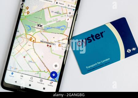 Google maps on smartphone and Oyster card the Transport for London travel card Stock Photo