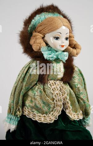green emerald velvet dress Vintage Victorian Porcelain Doll in a Green Dress Christmas Holiday Do – La  Guanaquita's Closet main image 0