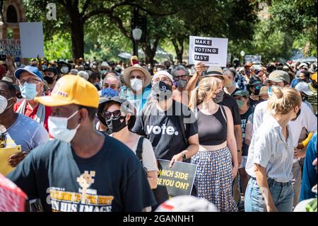 Austin, Texas, USA. 31 July, 2021. Rally at the State Capitol. The Poor People's Campaign ended their four day, 27-mile, march from Georgetown to Austin, Saturday morning at the Capitol. While it was called a voting rights rally, the campaign also asked for a raise in the minimum wage among other 'demands'. Credit: Sidney Bruere/Alamy Live News Stock Photo