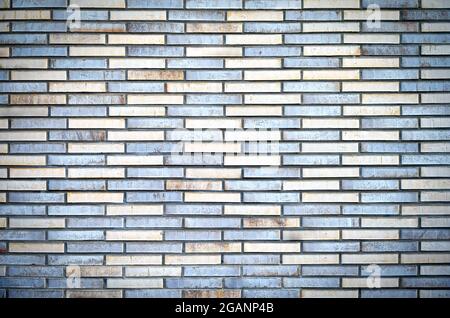 Vintage brick wall; multi-colored bricks, textured background; urban surface Stock Photo