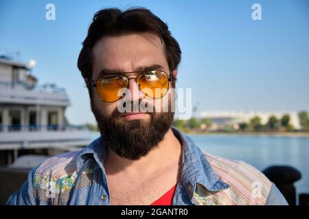 Outdoor portrait of young adult caucasian man Stock Photo