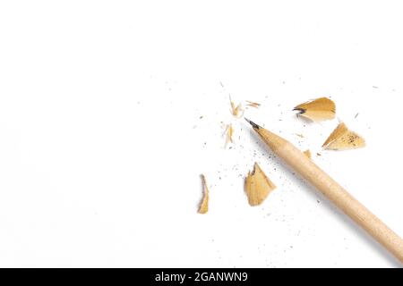 Pencil with sharpening shavings on white background. School college concept Stock Photo