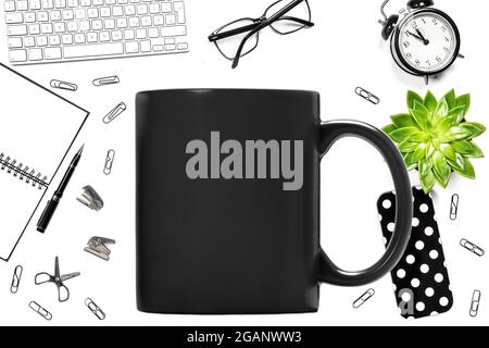 Black mug mock up. Office school props supplies on white background Stock Photo