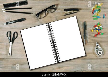 Open ring book mockup. Office, college and school supplies on wooden table background Stock Photo