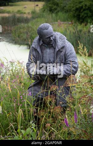 Statue of Sir Peter Scott founder of  the London Wetland Centre, by Nicola Godden,  in Barnes, South West London UK Stock Photo