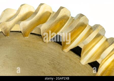 A macro photo of a new shiny copper gear, isolated on a white background. Stock Photo