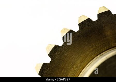 A macro photo of a new shiny copper gear, isolated on a white background. Stock Photo