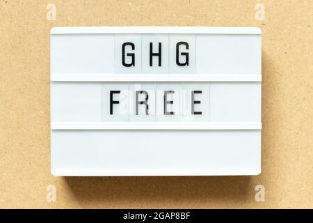 Lightbox with word GHG (Abbreviation of greenhouse gas) free on wood background Stock Photo