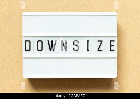Lightbox with word downsize on wood background Stock Photo