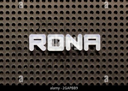 White color letter in word RONA (Abbreviation of Return on net assets) on black pegboard background Stock Photo