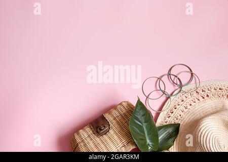 Flat lay summer composition with female accessories on pink background copy space. Stock Photo