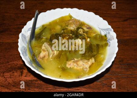 Sour white mustard soup with pork ribs recipe. Cooked in Asia, Myanmar. Stock Photo