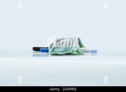 Bangladeshi five hundred taka banknotes with two pens on a white desk close up Stock Photo