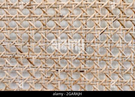 Closeup view of Handcraft woven bamboo strips pattern made in Myanmar. Stock Photo