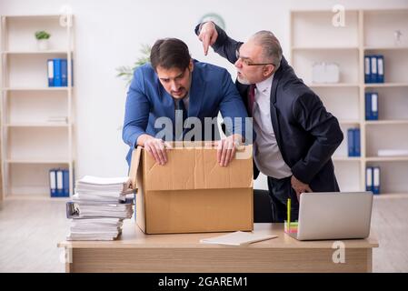 Two employees in dismissal concept Stock Photo