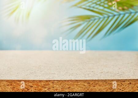 Design banner ads on summer season display concept , abstract blur tropical coconut leaves with white concrete table background for show . Stock Photo