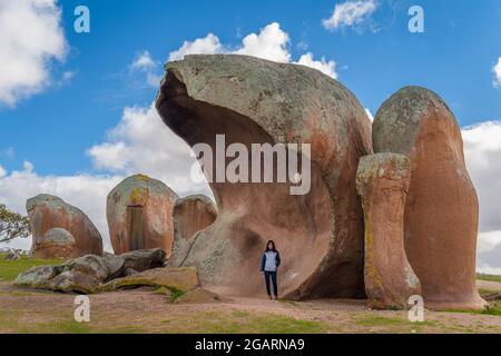 Gigantic red granite boulders known as Murphy's haystacks are a tourist attraction on farmland near Streaky Bay on Eyre Peninsula in South Australia. Stock Photo