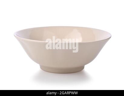 Empty beige ceramic bowl or ramekin isolated on a white background. Stock Photo