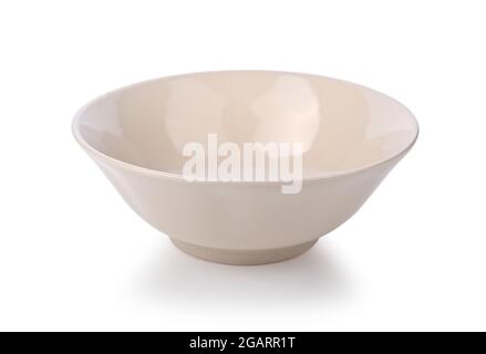 Beige or ramekin ceramic bowl on a white background Stock Photo