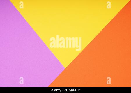 colorful paper background with triangle pattern in pink yellow and orange Stock Photo