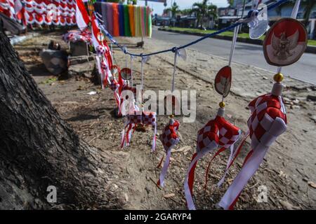 Palu, Indonesia. 01st Aug, 2021. The red and white diamonds are displayed on the side of Moh. Yamin Palu City, Central Sulawesi. The knick-knacks with the colors of the Indonesian flag began to be sold before the birthday of the Republic of Indonesia on August 17th. (Photo by Adi Pranata/Pacific Press) Credit: Pacific Press Media Production Corp./Alamy Live News Stock Photo