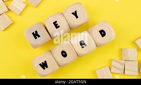 Selective focus of a word keword on a yellow background Stock Photo