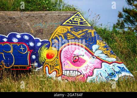 WWII German Blockhaus covered with urban paintings, Manche department, Cotentin, Normandy, France Stock Photo