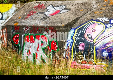 WWII German Blockhaus covered with urban paintings, Manche department, Cotentin, Normandy, France Stock Photo