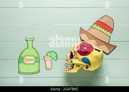 Composition with painted human skull for Mexico's Day of the Dead (El Dia de Muertos) on wooden background Stock Photo