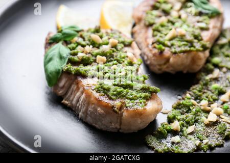 Plate with tasty steaks and sauce pesto, closeup Stock Photo