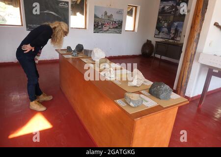 Museum in Colca Canyon in Peru objects object girl blonde looking view rocks rock pot pots wall art artistic views viewing designed table picture Stock Photo
