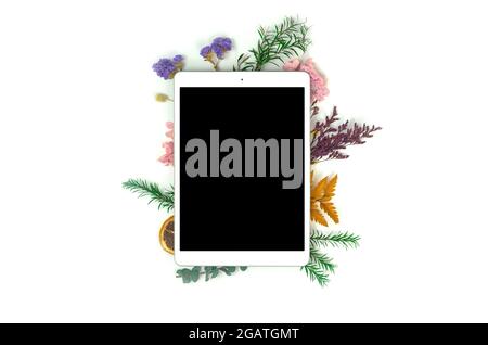 Desktop workspace tablet mockup flatlay with floral dried flower frame composition concept, creative concept, copy space Stock Photo