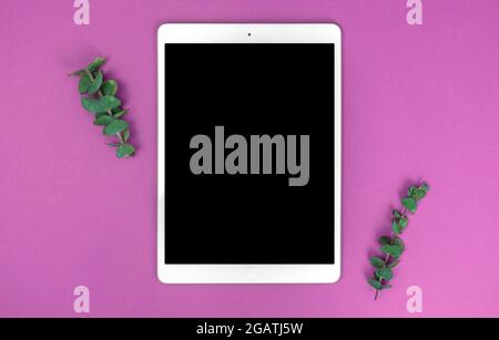 Office desk workspace background with digital tablet pc, top view for present advertising product on tablet screen, copy space Stock Photo
