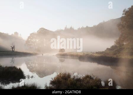 River Brathay near Elter Water in a foggy Langdale Valley, English Lake District Stock Photo