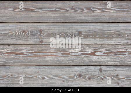 Old wooden floor with beautiful texture, view from the top. Seamless texture of wooden boards. Stock Photo