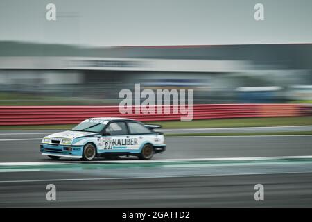 Towcester, Northamptonshire, UK. 1st Aug, 2021. Racing driver Graeme Dodd (GB) and Ford Sierra Cosworth RS500 drives during Adrian Flux Trophy for MRL Historic Touring Car Challenge during The Classic Motor Racing Festival at Silverstone Circuit ( Credit: Gergo Toth/Alamy Live News Stock Photo