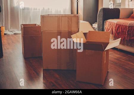Moving day, Move Into New Home, Moving home checklist. Carton boxes with clothes and other things prepared for moving in or moving out of home Stock Photo
