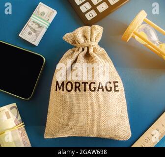 Money bag with the word Mortgage. Mortgage rates concept. Loan and credit. Interest payment. Business and finance. Real estate, housing Stock Photo