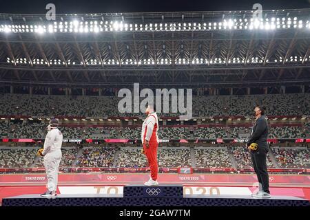 Tokyo, Japan. 1st Aug, 2021. Gold medalist Gong Lijiao (C) of China, silver medalist Raven Saunders (L) of the United States and bronze medalist Valerie Adams of New Zealand react during the awarding ceremony of the Women's Shot Put at the Tokyo 2020 Olympic Games in Tokyo, Japan, Aug. 1, 2021. Credit: Ju Huanzong/Xinhua/Alamy Live News Stock Photo